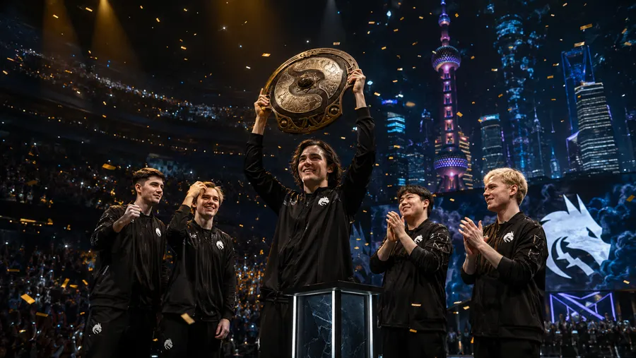 Team Spirit players celebrating on stage with the Aegis of Champions trophy, Shanghai skyline behind them